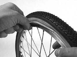 bicycle inner tube pinched by the tire - camera d